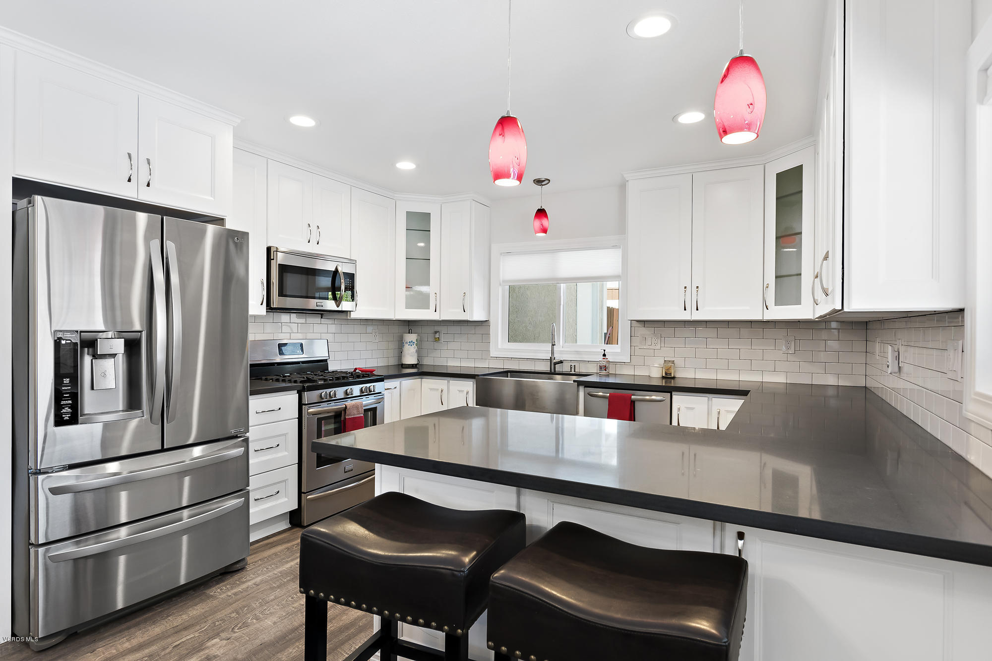 2551 Fitzgerald Road Simi Valley, CA 93065 - Photo 8 of 17 a kitchen with stainless steel appliances granite countertop a refrigerator sink and microwave