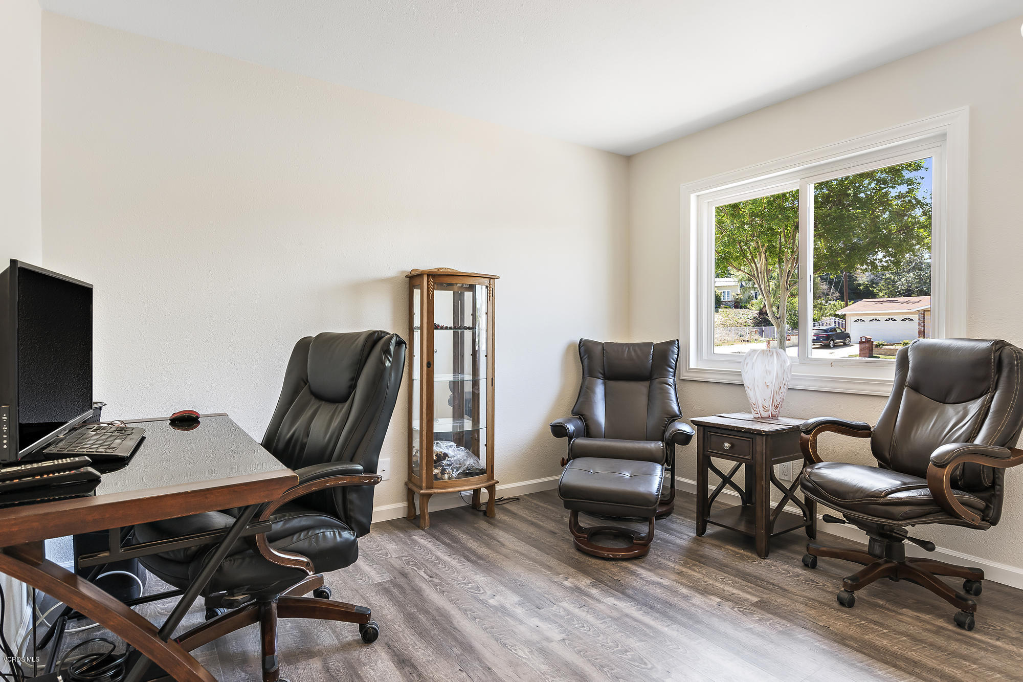 2551 Fitzgerald Road Simi Valley, CA 93065 - Photo 9 of 17 a view of a workspace with furniture and a window
