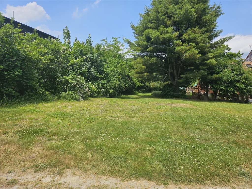2 Washburn Avenue Fairhaven, MA 02719 - Photo 1 of 1 a view of a green field with trees in the background