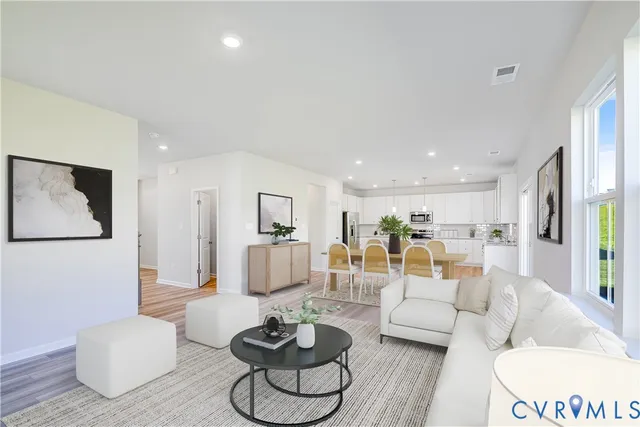 a living room with furniture and a table