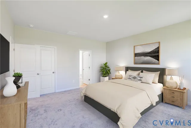 a bedroom with a bed and painting on the wall