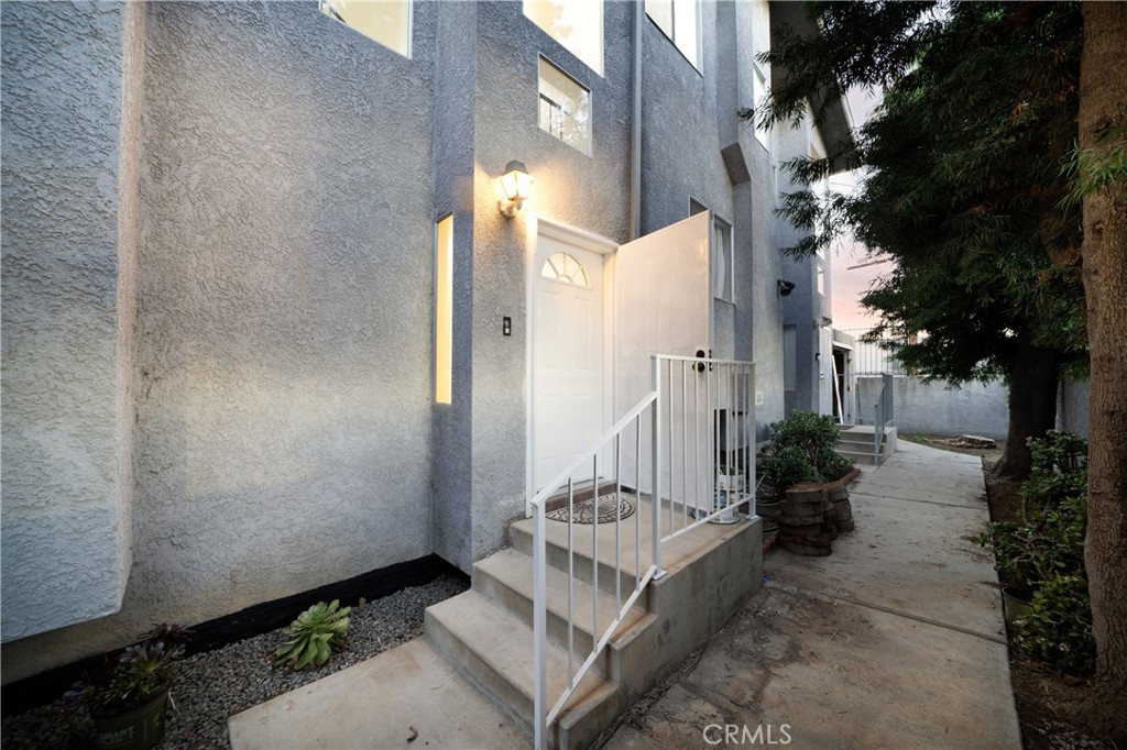 1067 252nd Street, Unit 7 Harbor City, CA 90710 - Photo 17 of 23 a view of a house with fountain in backyard