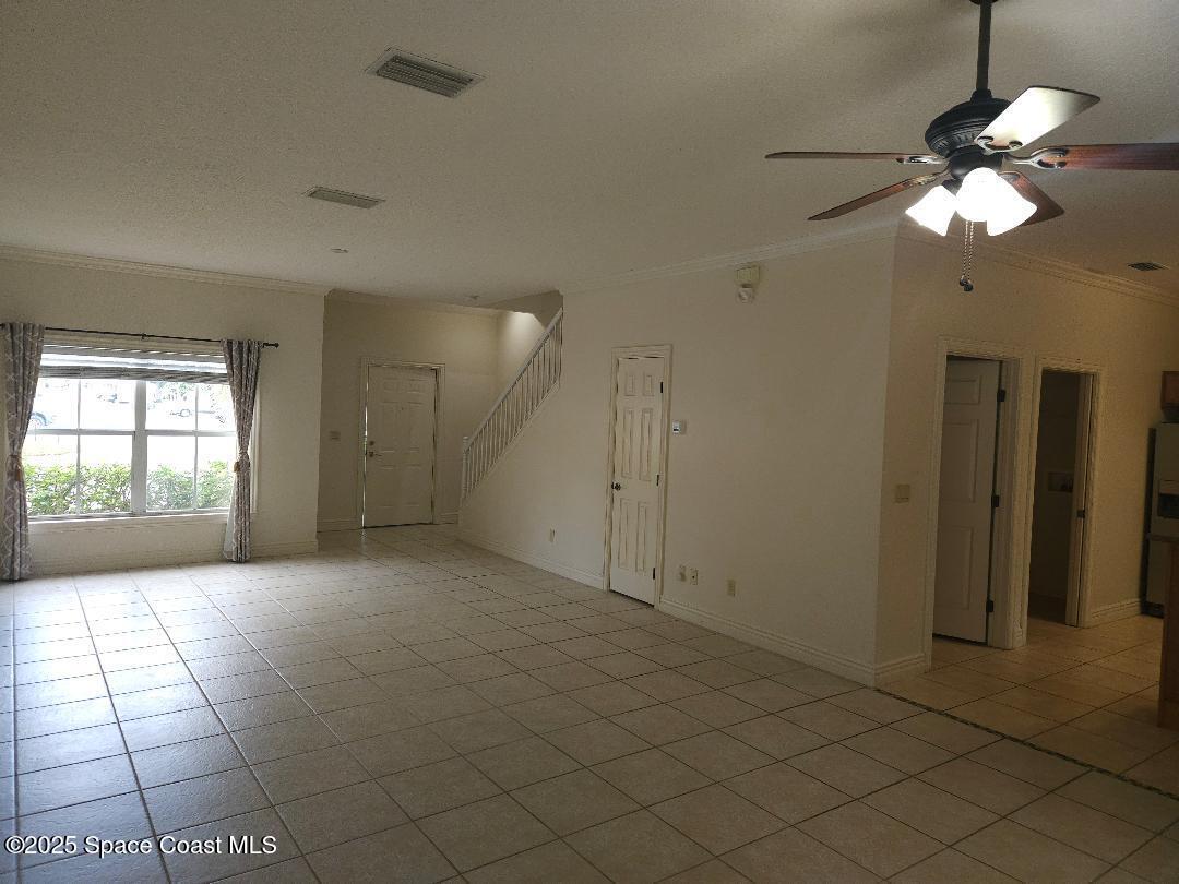 630 Cedar Side Circle Northeast Palm Bay, FL 32905 - Photo 3 of 17 a view of an empty room with a window