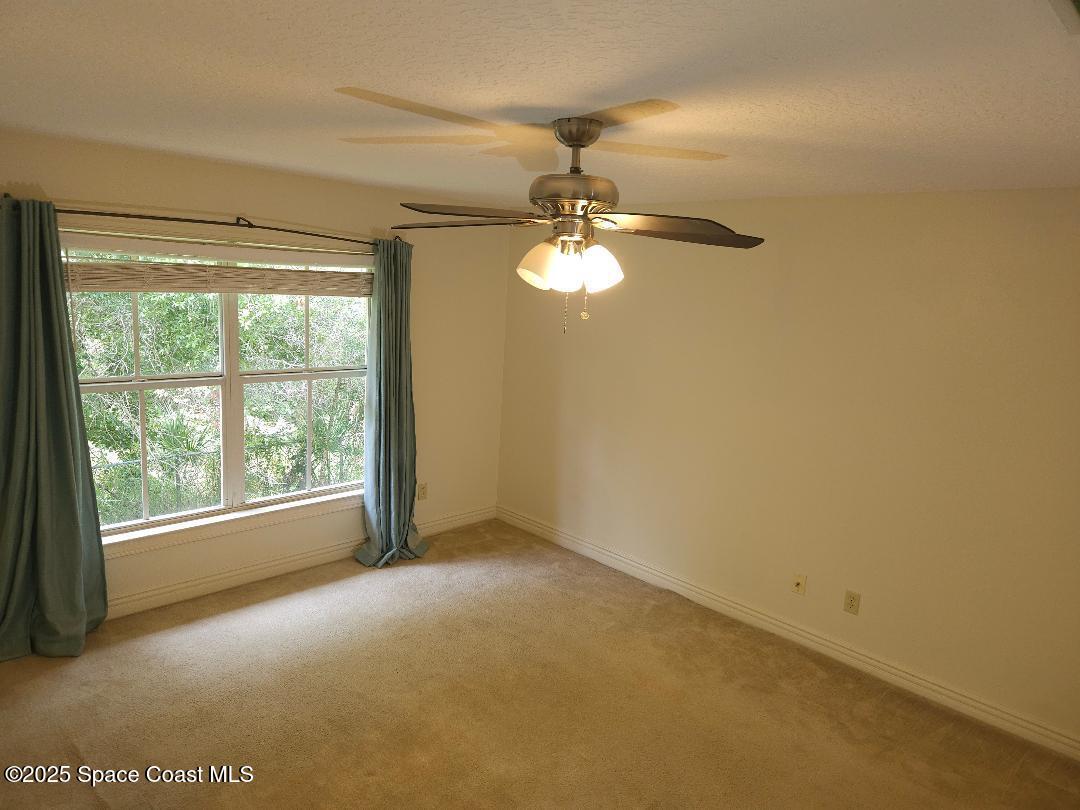 630 Cedar Side Circle Northeast Palm Bay, FL 32905 - Photo 9 of 17 a view of an empty room with a window