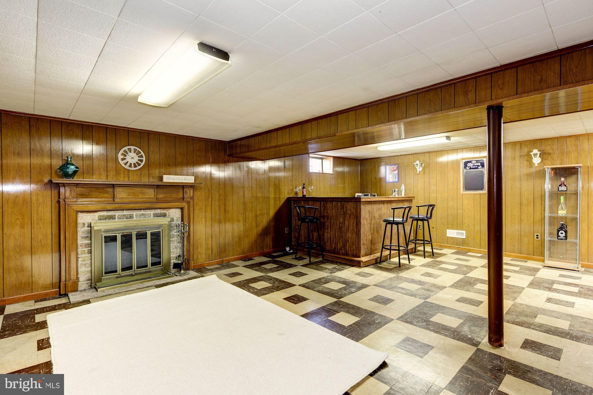 6104 Moorefield Road Catonsville, MD 21228 - Photo 24 of 30 Lower level Rec Room with fireplace