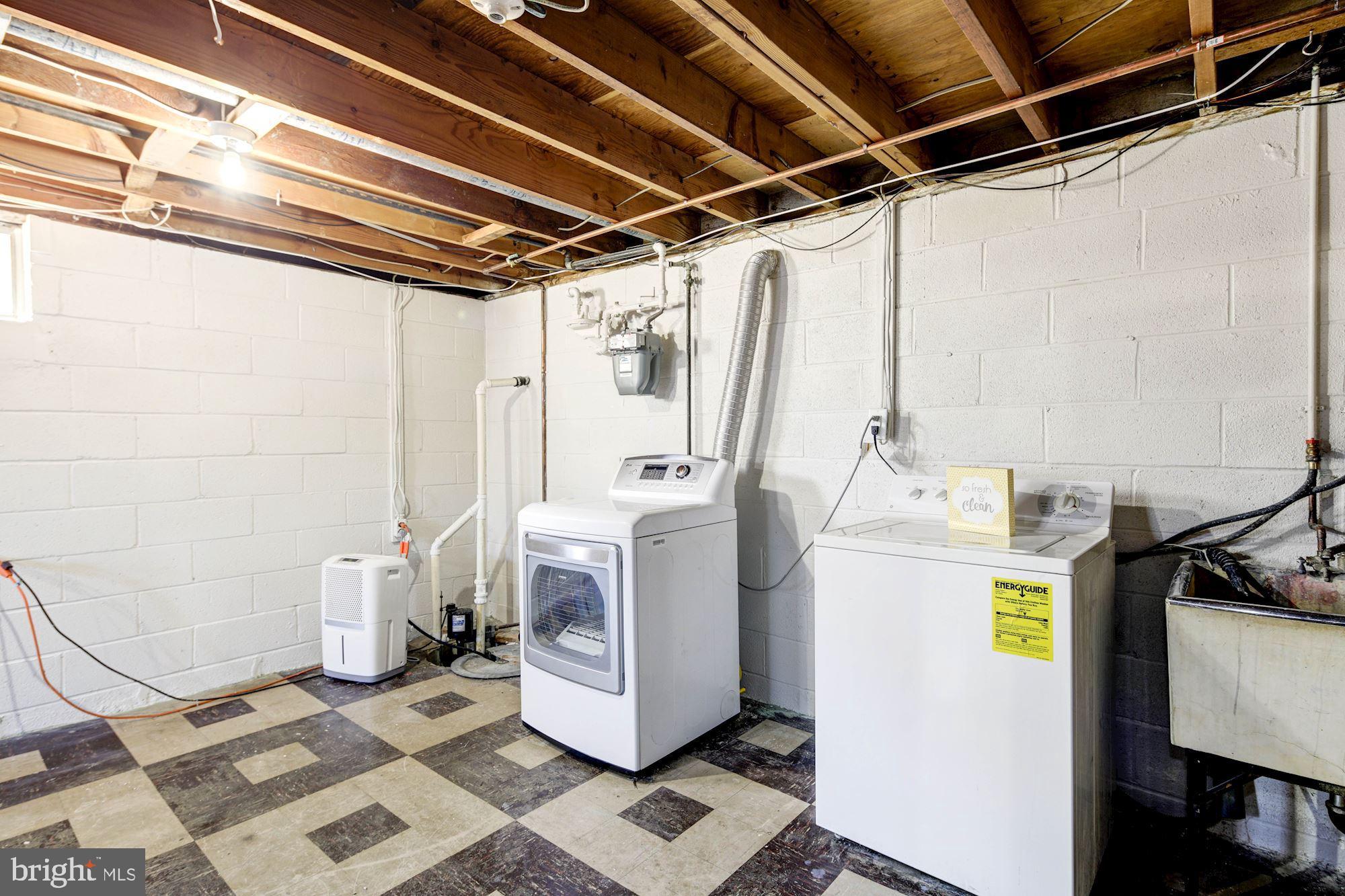 6104 Moorefield Road Catonsville, MD 21228 - Photo 26 of 30 Storage room with washer, dryer and utility sink