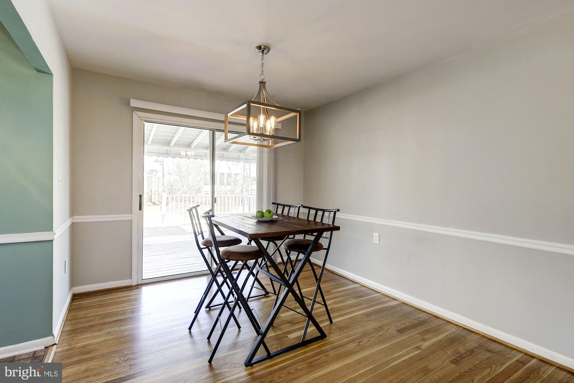 6104 Moorefield Road Catonsville, MD 21228 - Photo 8 of 30 Dining room with chair rail & new light fixture