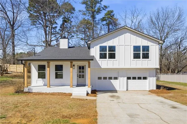 a front view of a house with garage
