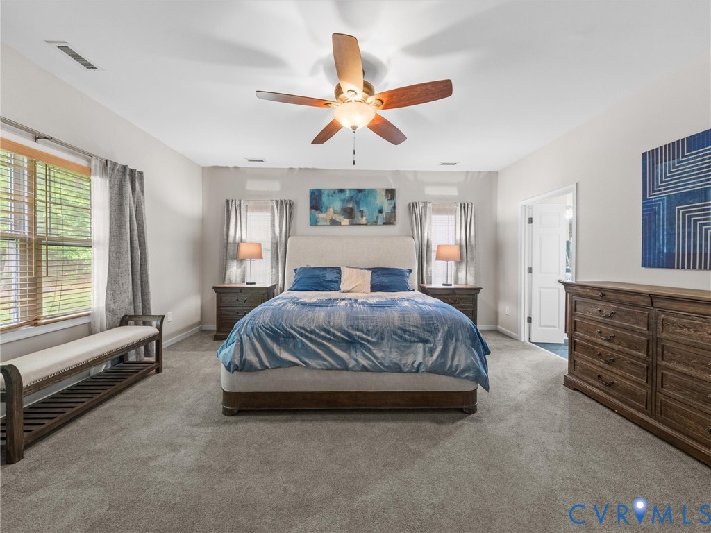 10824 Avening Road Chesterfield, VA 23832 - Photo 22 of 47 a spacious bedroom with a bed and window