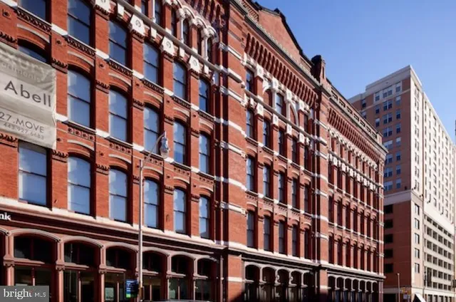 a view of an empty room and wooden floor