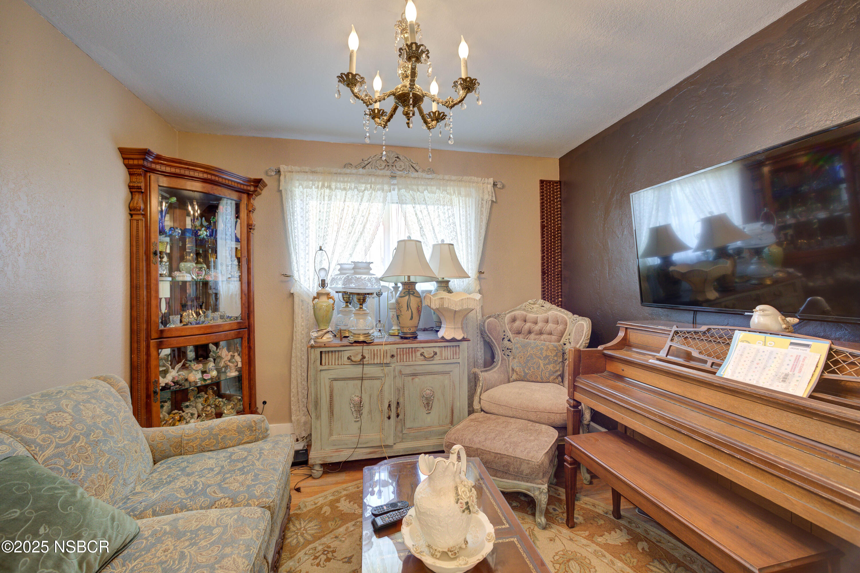 421 South O Place Lompoc, CA 93436 - Photo 6 of 12 a living room with furniture and a flat screen tv