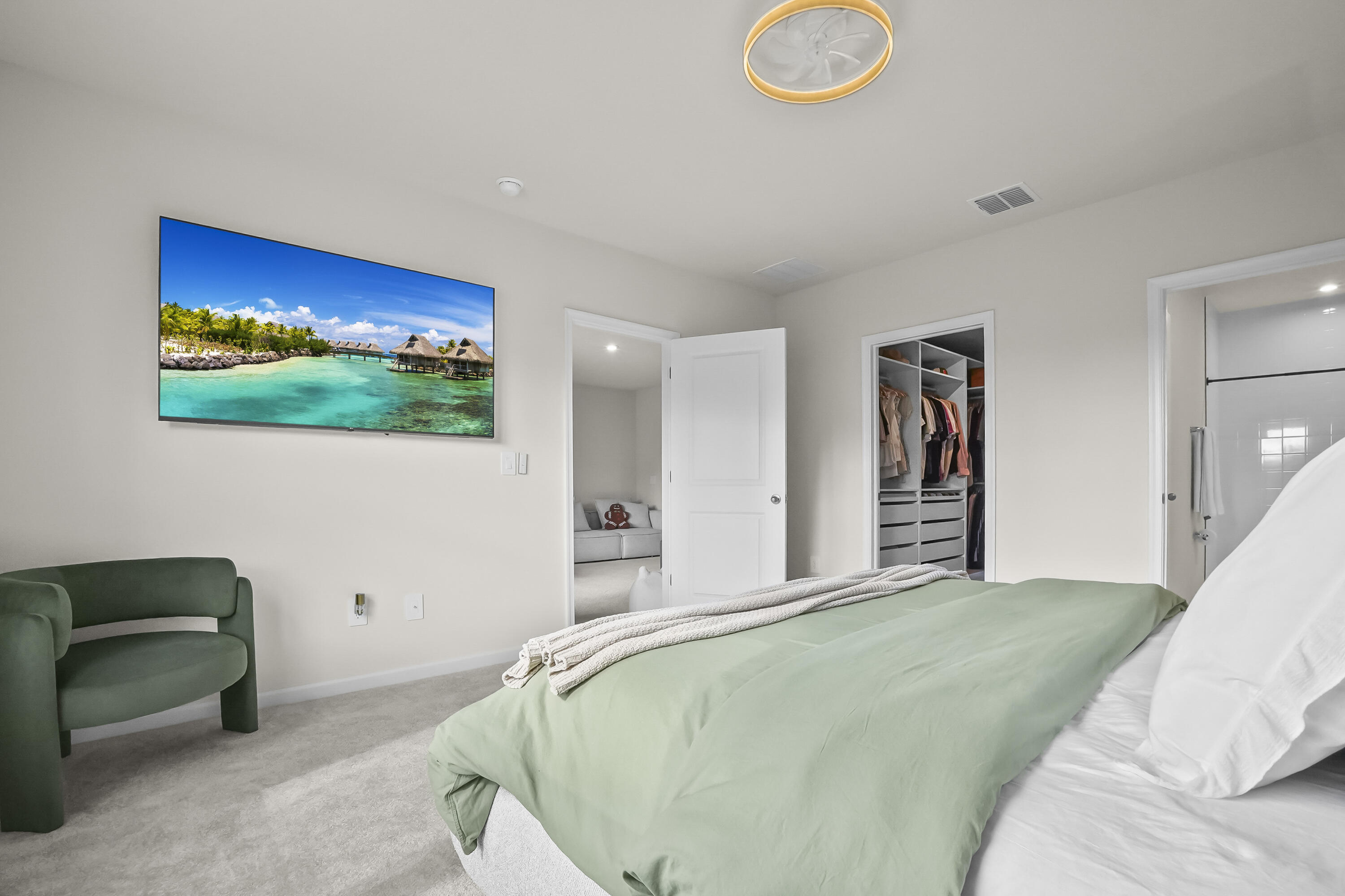 309 Raspberry Road Fort Pierce, FL 34981 - Photo 22 of 38 a bedroom with a bed and a painting on the wall