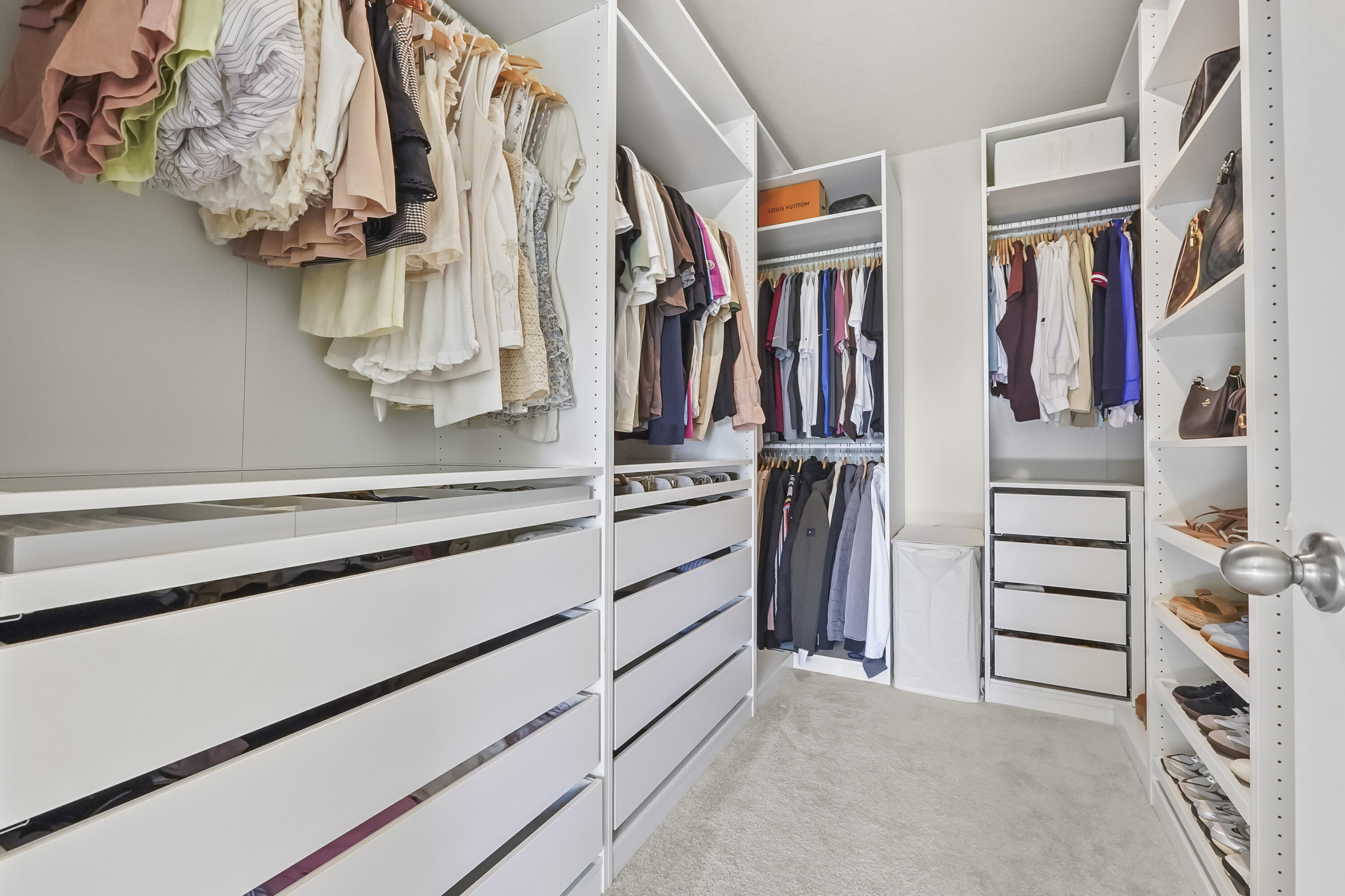 309 Raspberry Road Fort Pierce, FL 34981 - Photo 24 of 38 a view of walk in closet with clothes and shoes