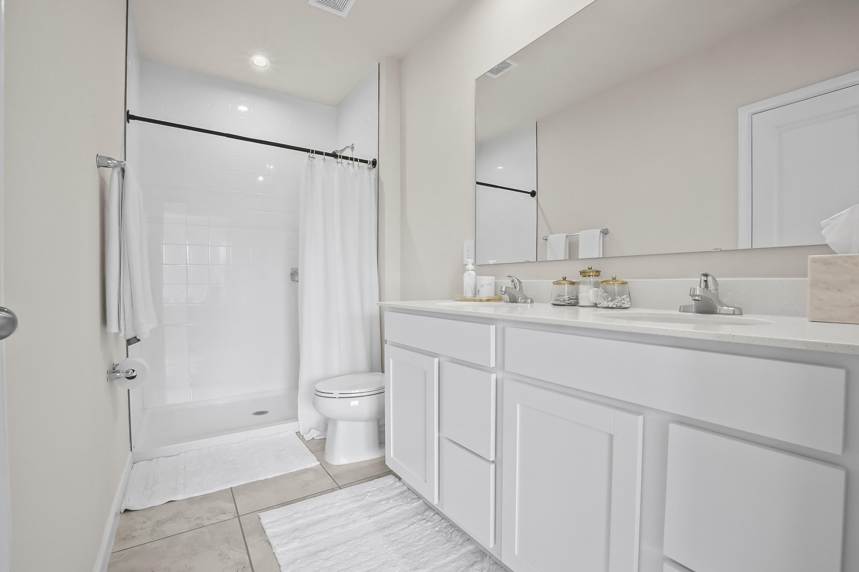 309 Raspberry Road Fort Pierce, FL 34981 - Photo 26 of 38 a bathroom with a sink toilet and shower