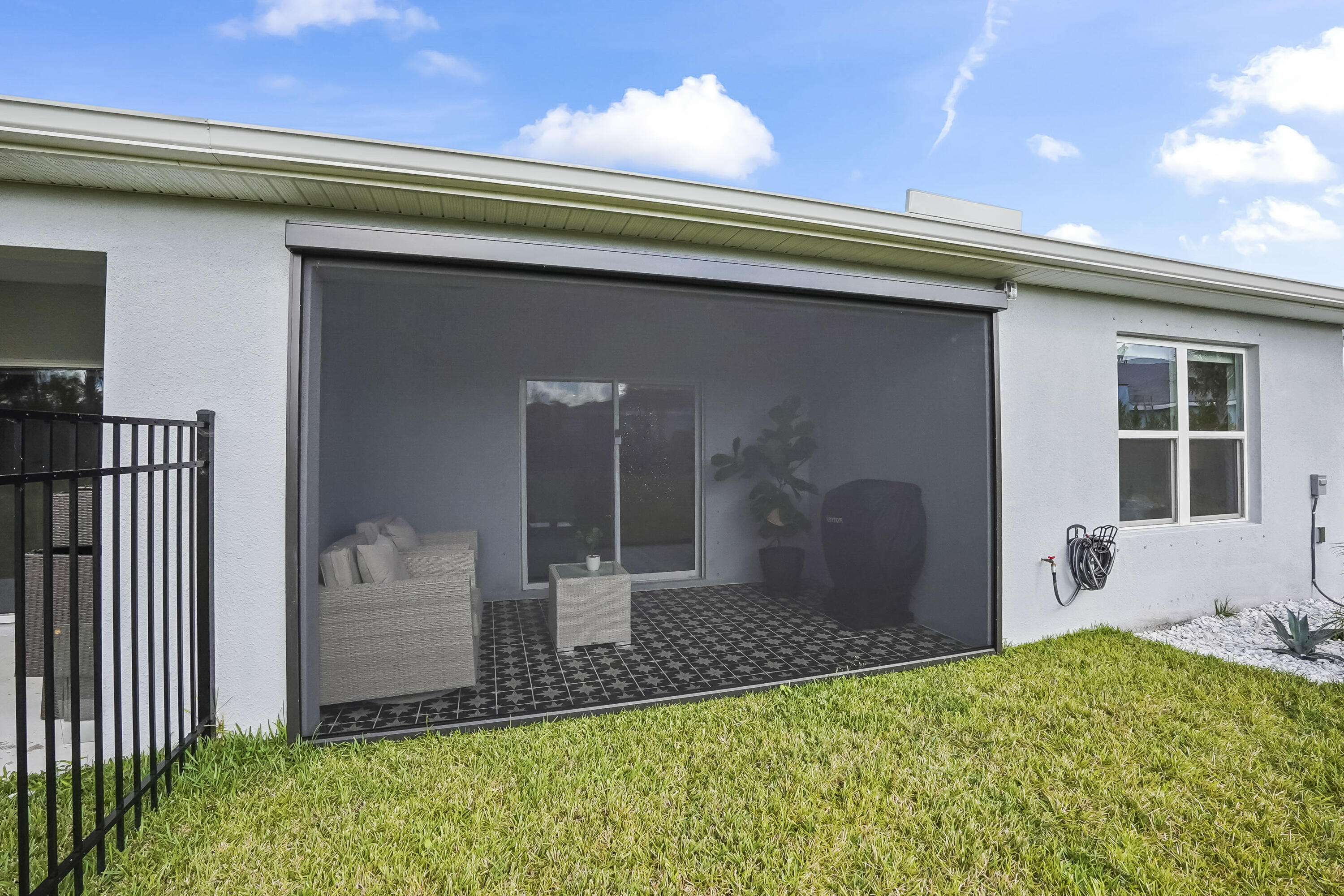 309 Raspberry Road Fort Pierce, FL 34981 - Photo 27 of 38 a front view of a house with a yard