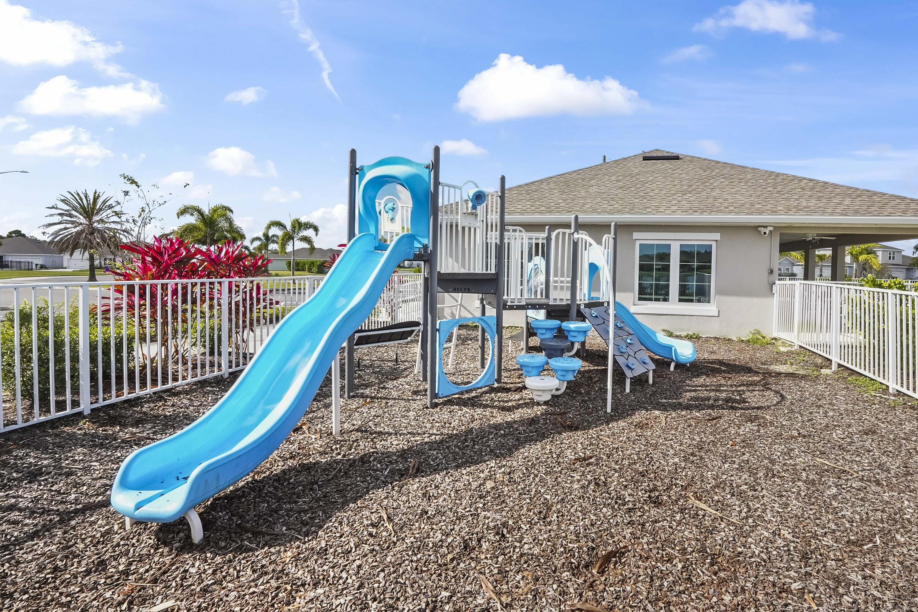 309 Raspberry Road Fort Pierce, FL 34981 - Photo 36 of 38 a view of a house with a backyard