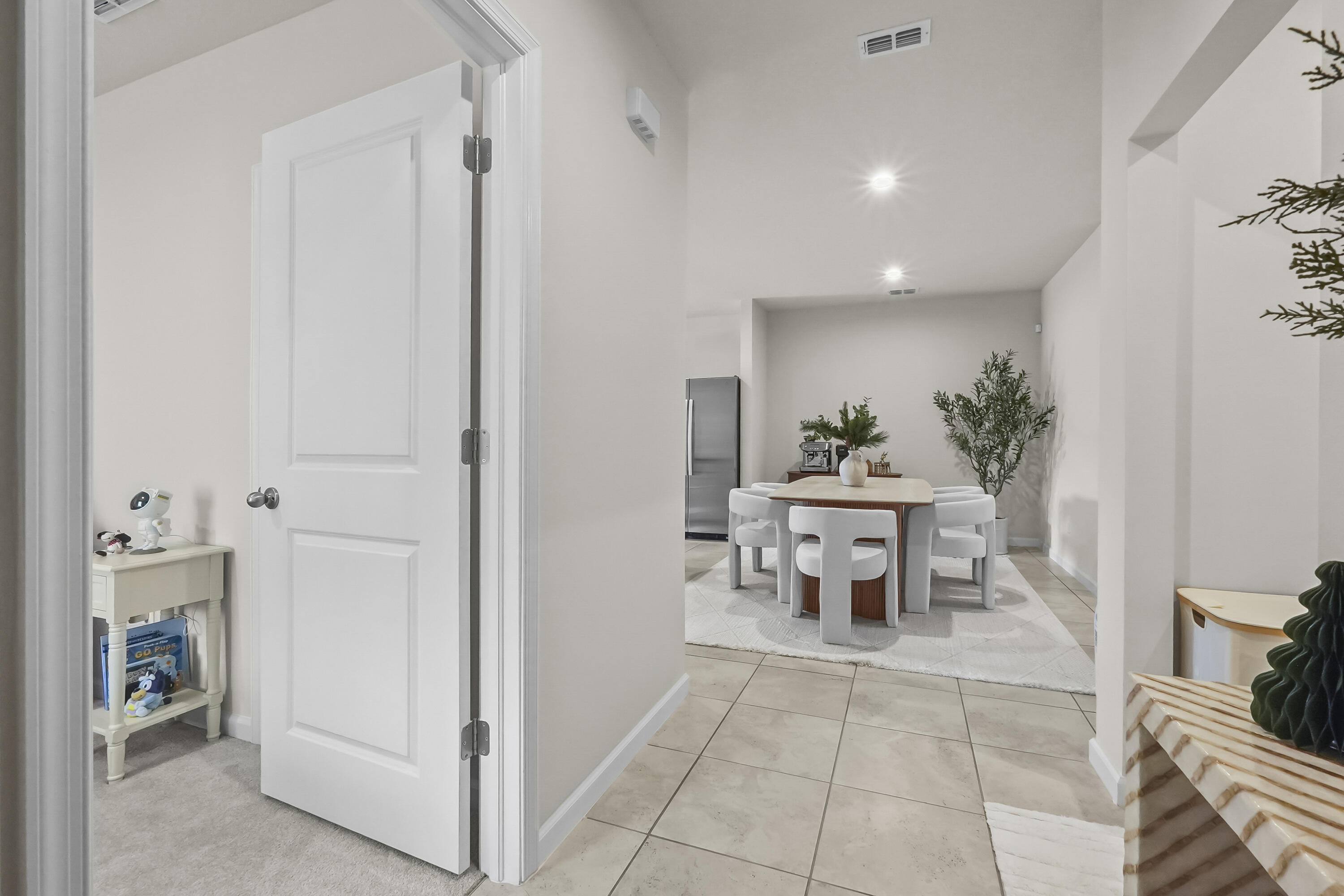 309 Raspberry Road Fort Pierce, FL 34981 - Photo 5 of 38 a dining room with furniture and a chandelier