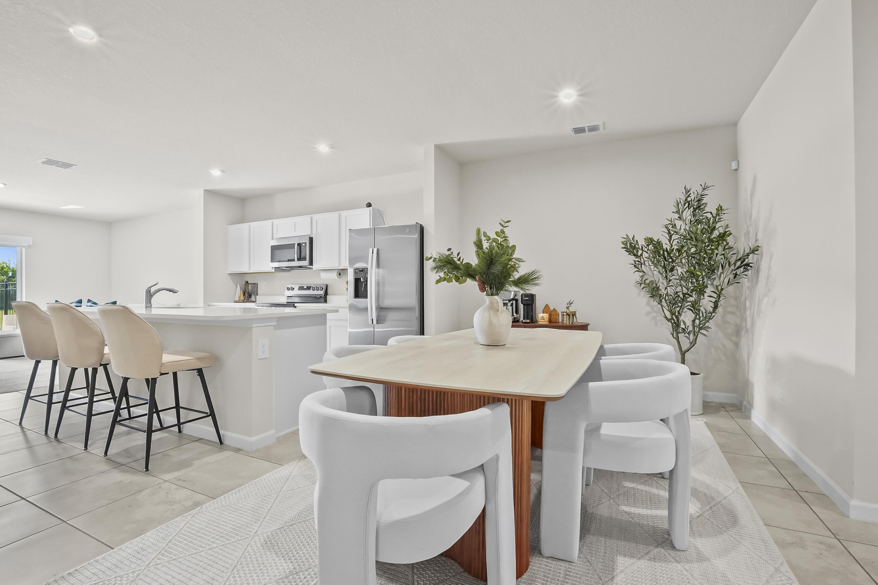 309 Raspberry Road Fort Pierce, FL 34981 - Photo 7 of 38 a view of a dining room with furniture and chandelier