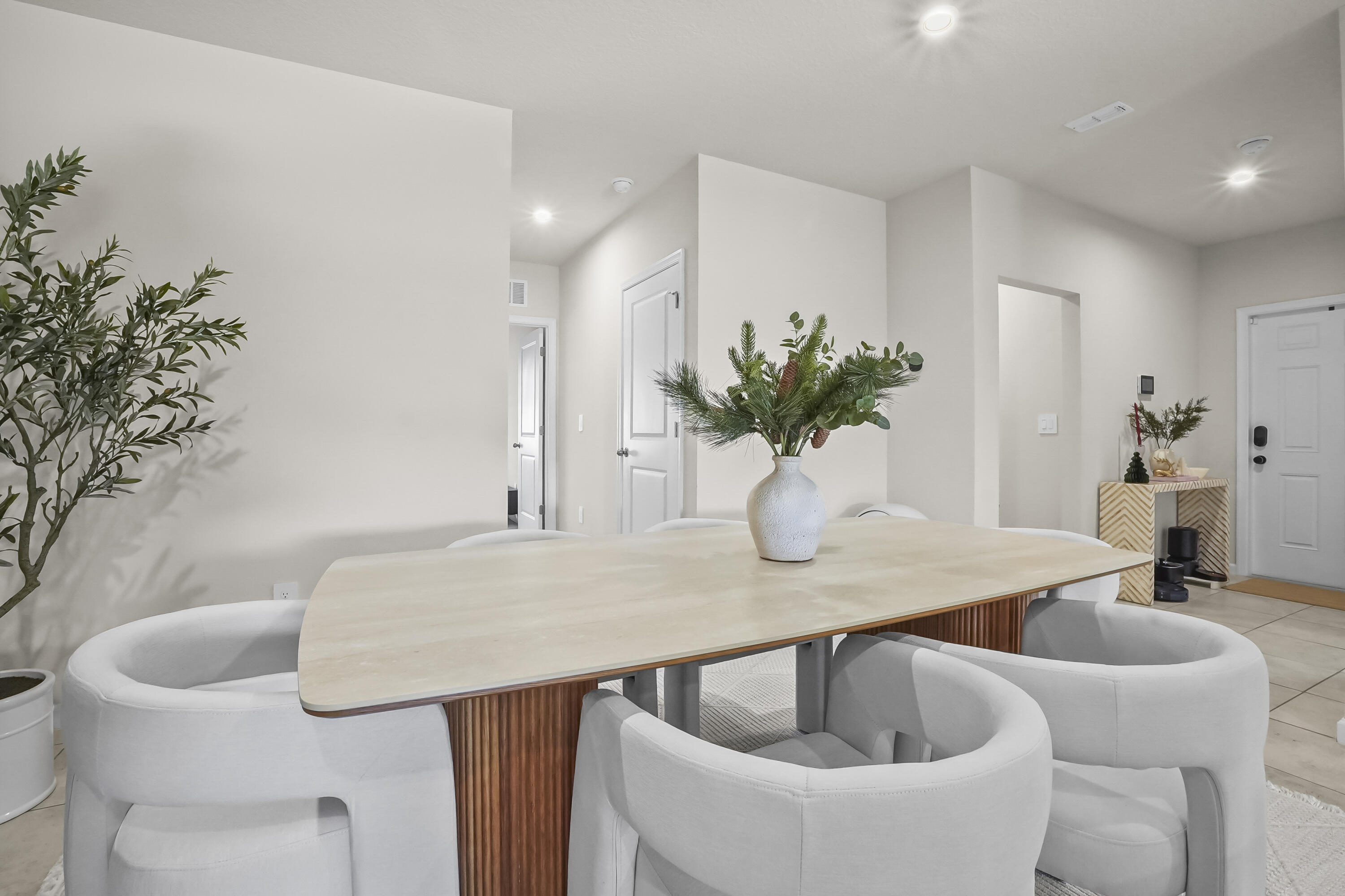 309 Raspberry Road Fort Pierce, FL 34981 - Photo 8 of 38 a kitchen with a table and chairs