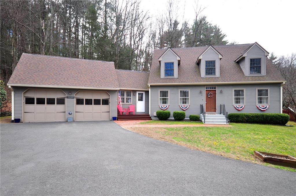51 Cherry Brook Road Canton, CT 06019 - Photo 1 of 1 a front view of a house with a yard and garage