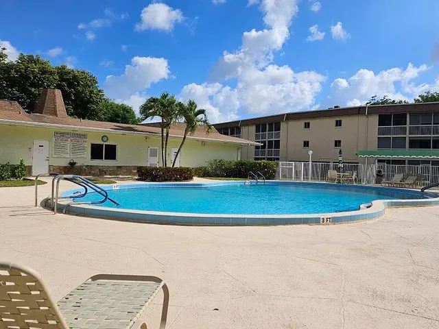 a view of a dining room with furniture and window