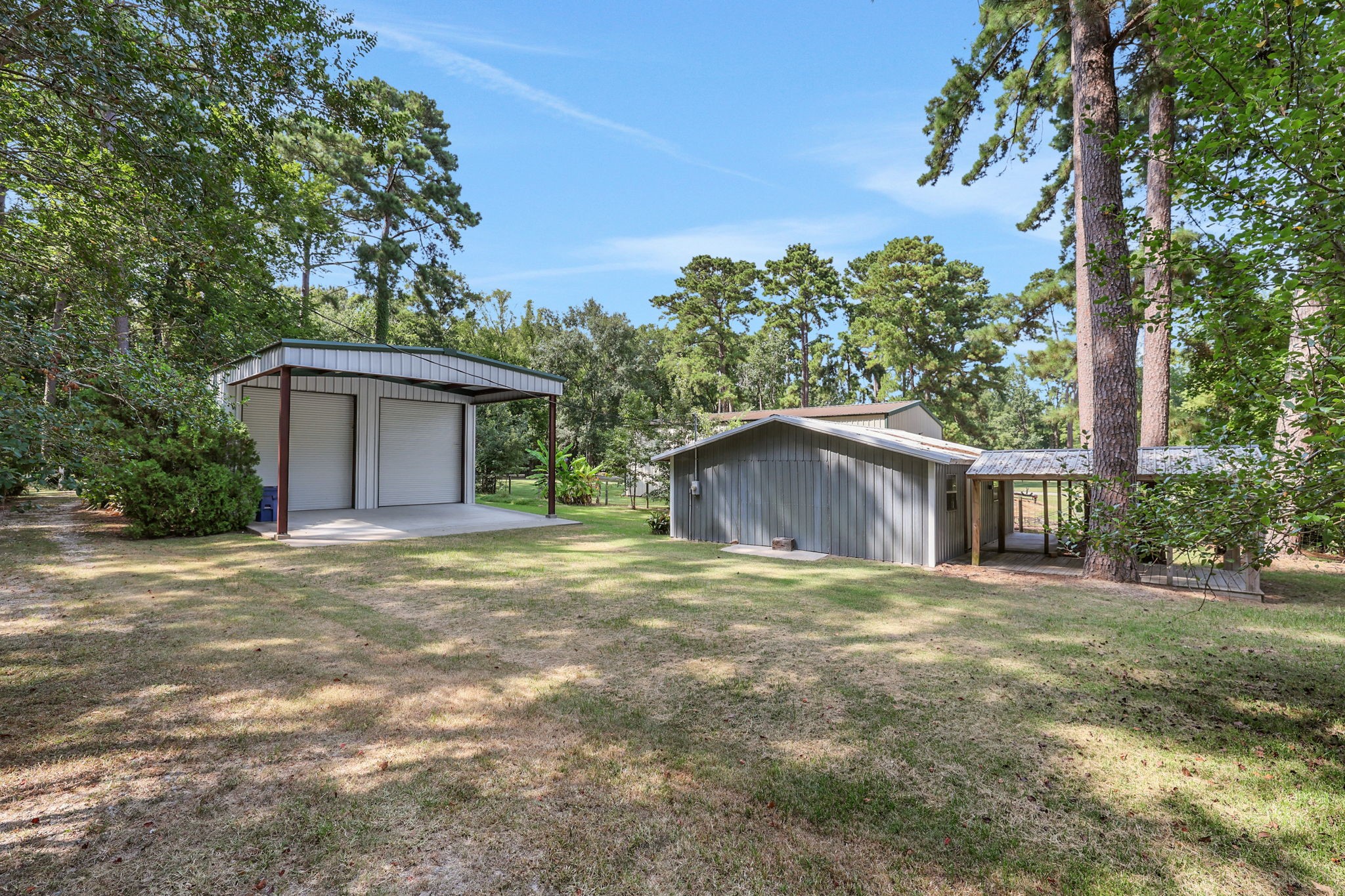 200 Johnson Road Coldspring, TX 77331 - Photo 8 of 47 There is a large 1200 sf metal barn along with an additional storage shed