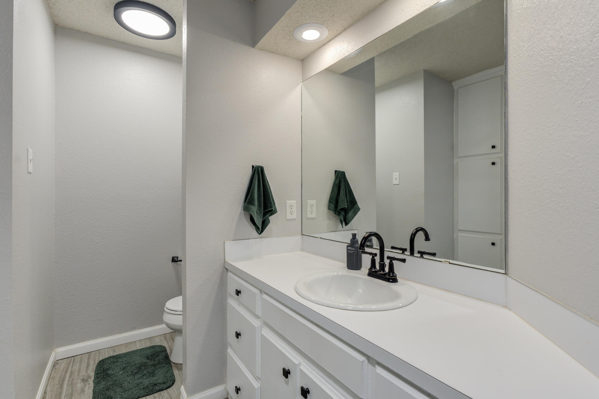 5813 88th Place Lubbock, TX 79424 - Photo 26 of 30 a bathroom with a sink and a mirror