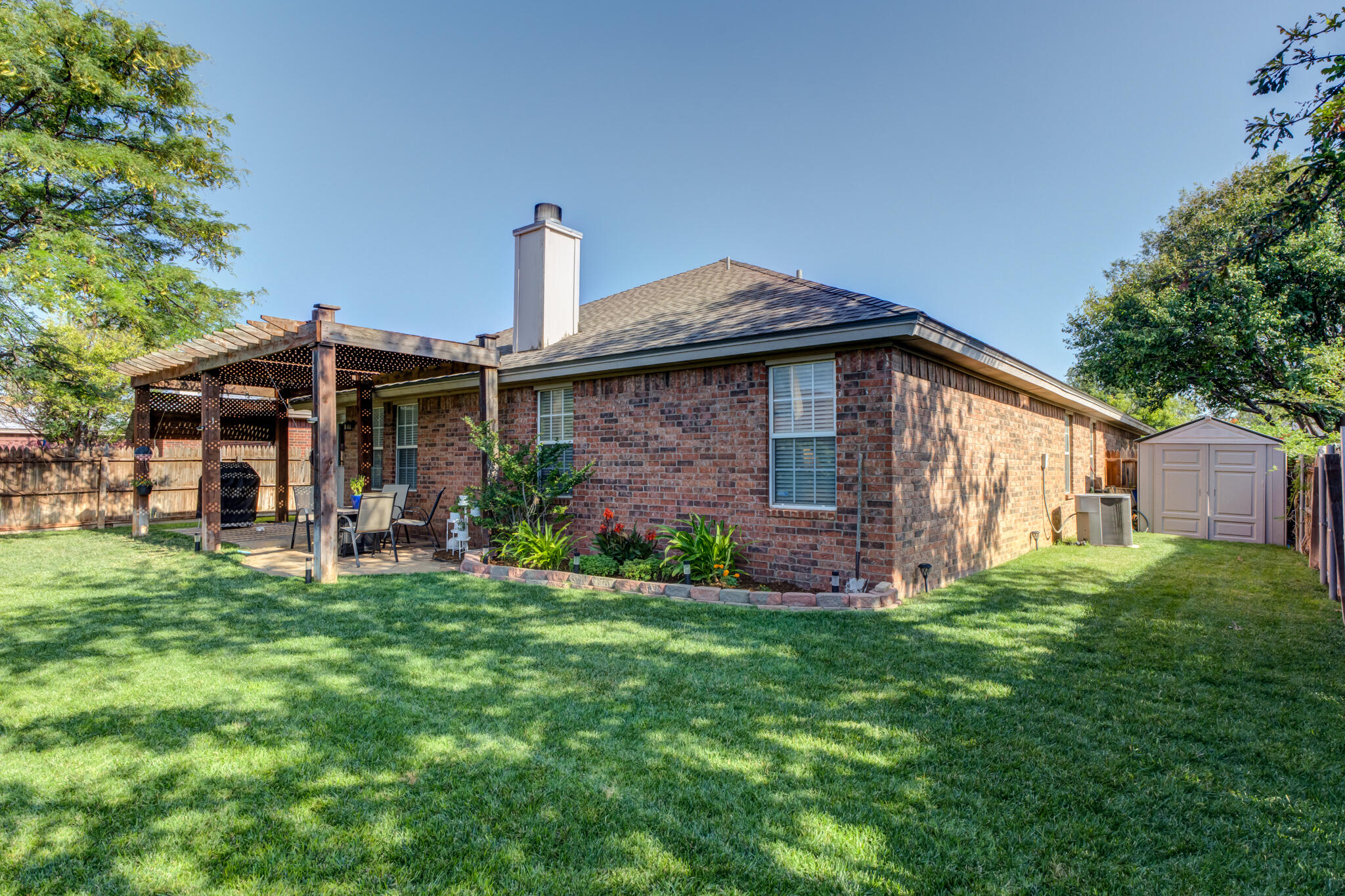 5813 88th Place Lubbock, TX 79424 - Photo 30 of 30 a view of a house with a yard and sitting area