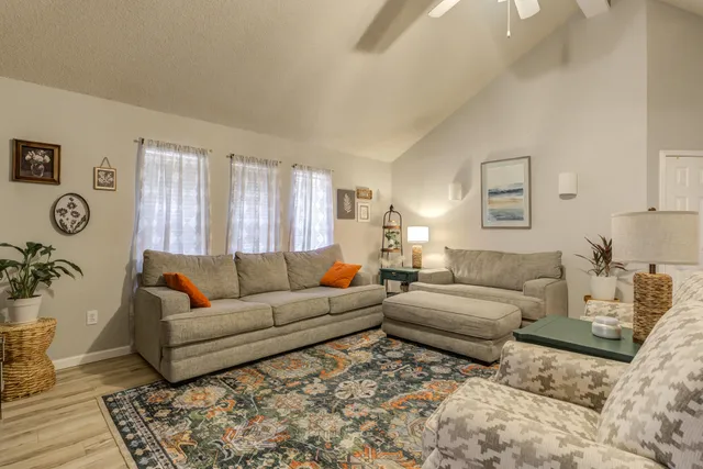 a living room with a couch and a window