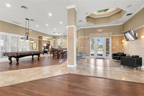a lobby with furniture and wooden floor