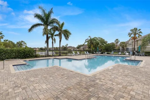 a view of a swimming pool with a lake view