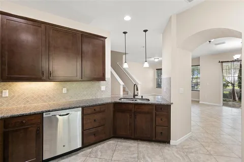 a kitchen with a sink and cabinets