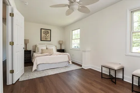 a bedroom with a bed and a table