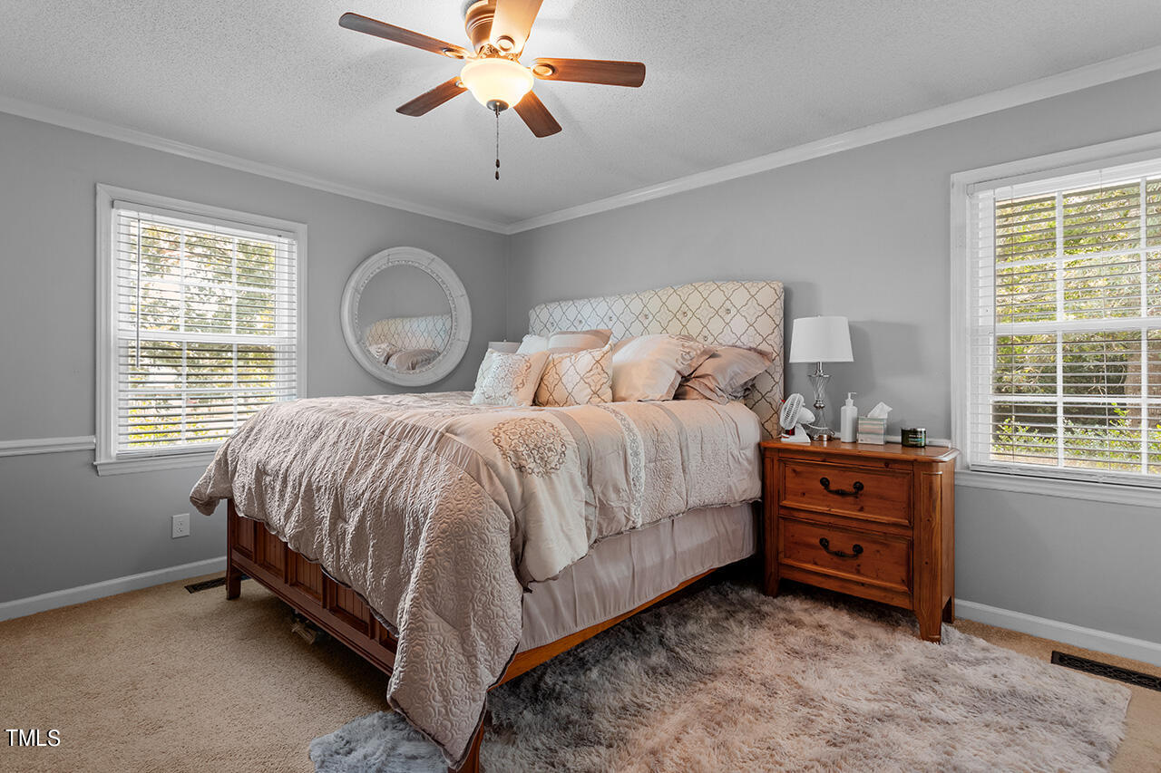 1660 Benson Road Angier, NC 27501 - Photo 19 of 32 Retreat to the spacious primary suite.