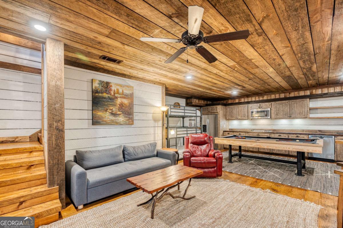 280 Pointe Of View, Unit 15 Blue Ridge, GA 30513 - Photo 50 of 72 a living room with furniture and a wooden floor