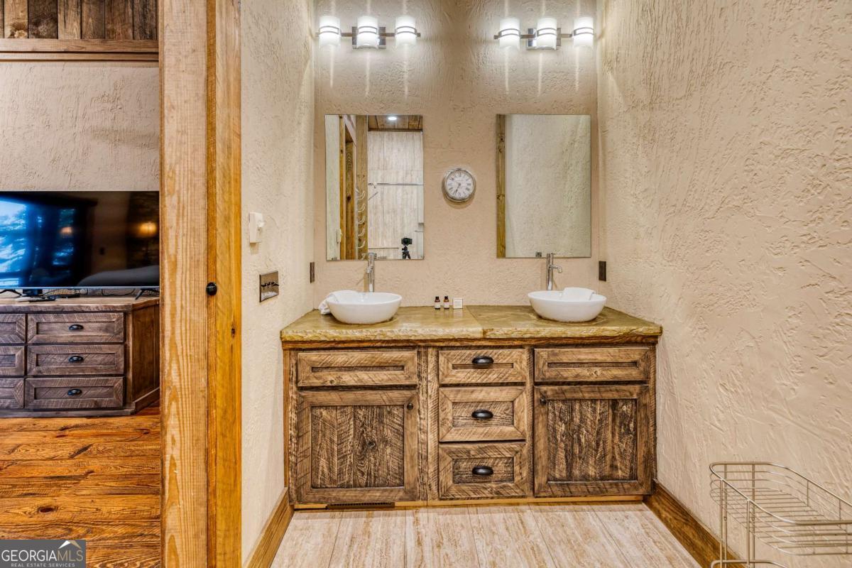 280 Pointe Of View, Unit 15 Blue Ridge, GA 30513 - Photo 64 of 72 a bathroom with a sink a vanity and a mirror