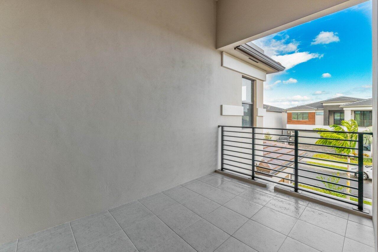 8518 Shoreacres Street Boca Raton, FL 33434 - Photo 36 of 45 Covered Balcony Facing Front of home