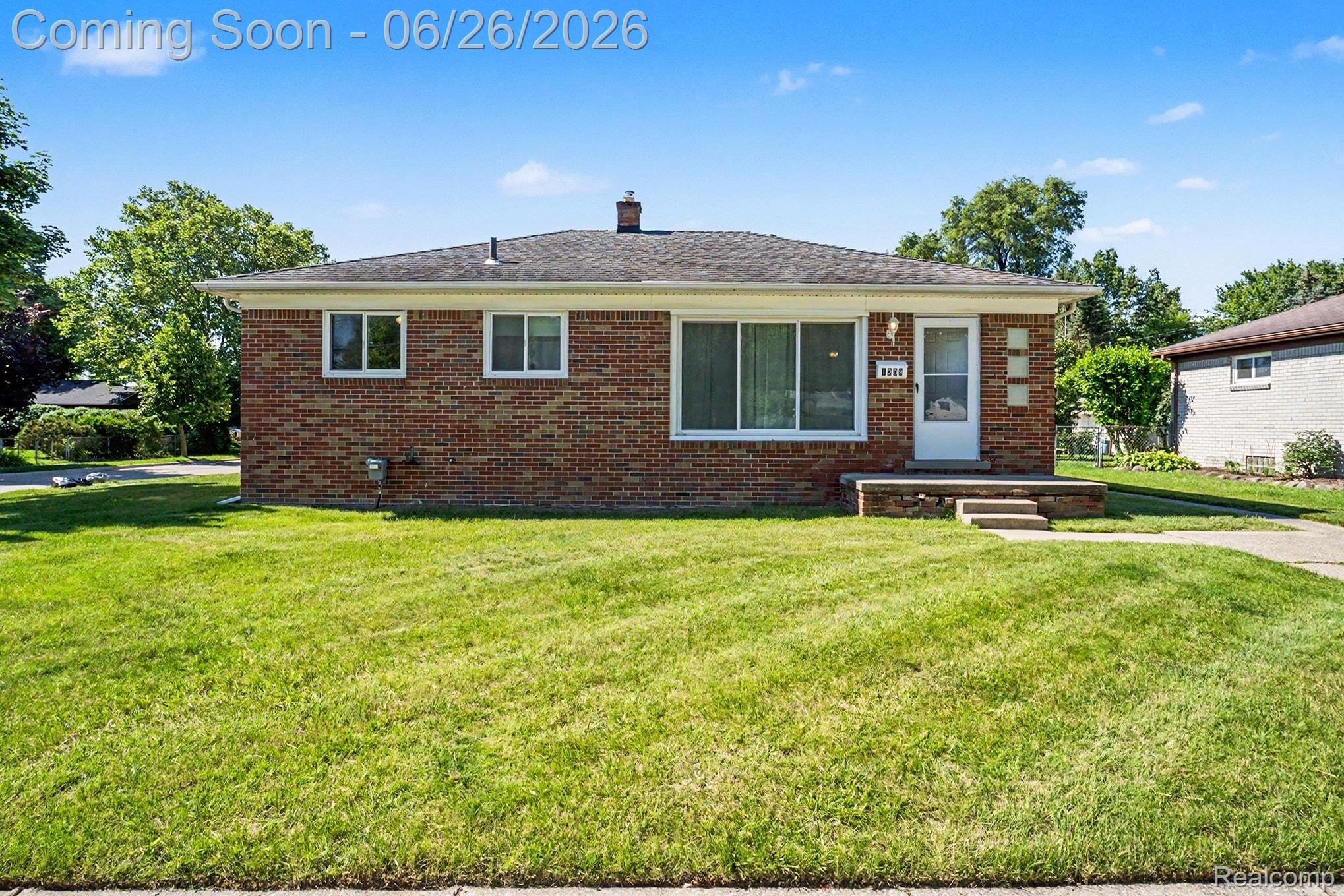 1209 Massoit Road Clawson, MI 48017 - Photo 6 of 25 Ranch-style residence featuring a brick facade, white trim, and a gabled roof