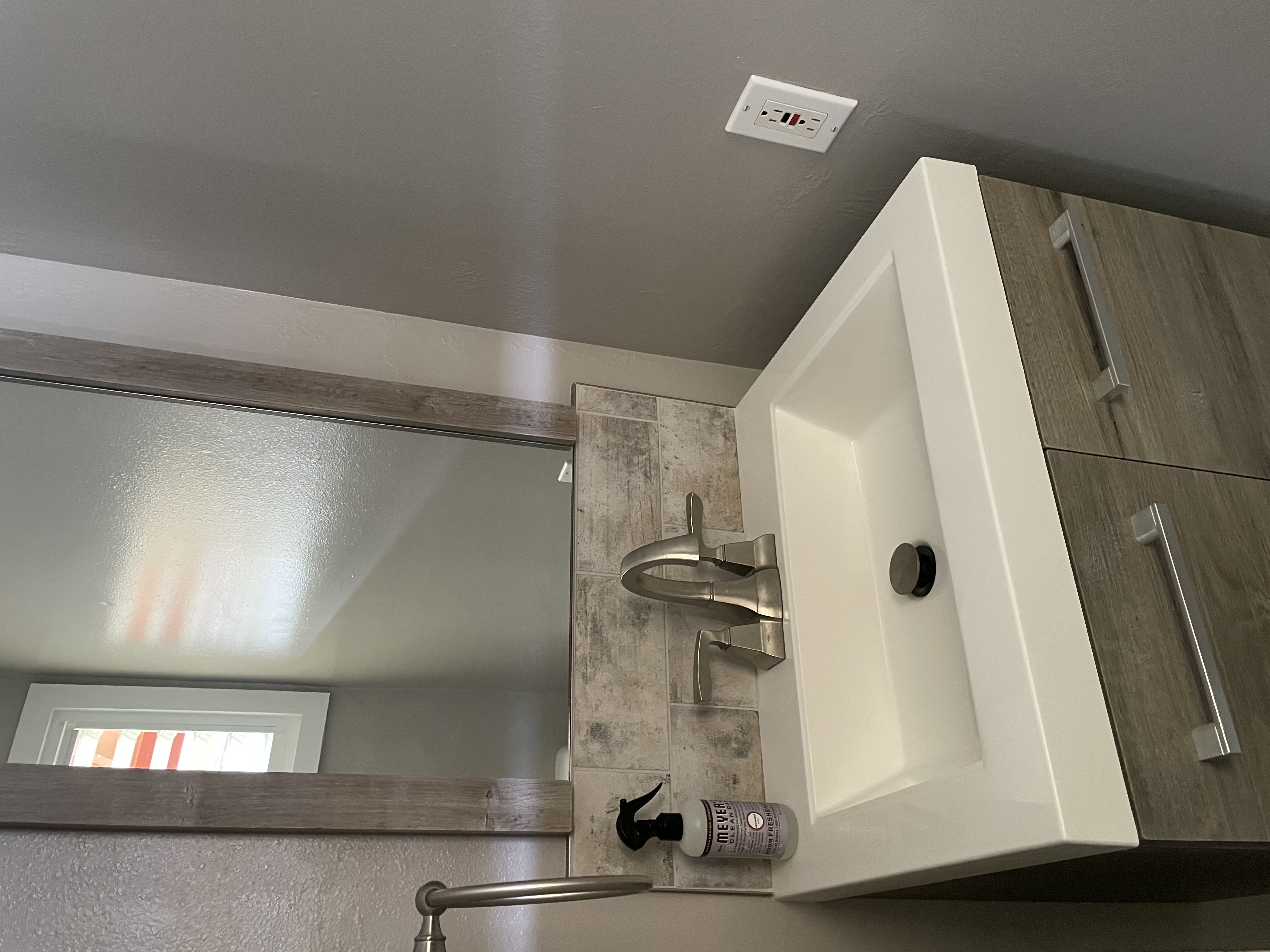 4461 Kamoa Road, Unit F21 Kapaa, HI 96746 - Photo 12 of 20 a bathroom with a sink and a mirror