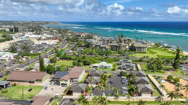 an aerial view of residential houses with outdoor space