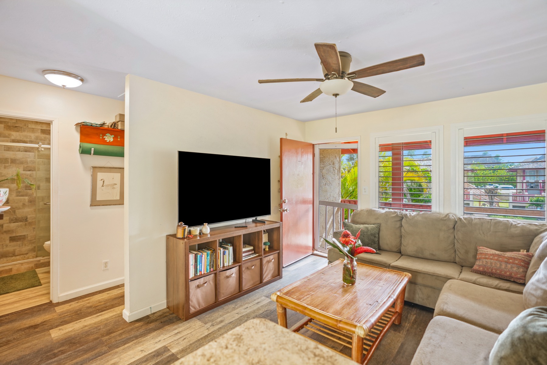 4461 Kamoa Road, Unit F21 Kapaa, HI 96746 - Photo 4 of 20 a living room with furniture and a flat screen tv