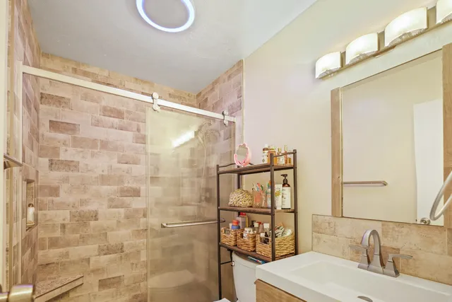 a bathroom with a sink and a mirror