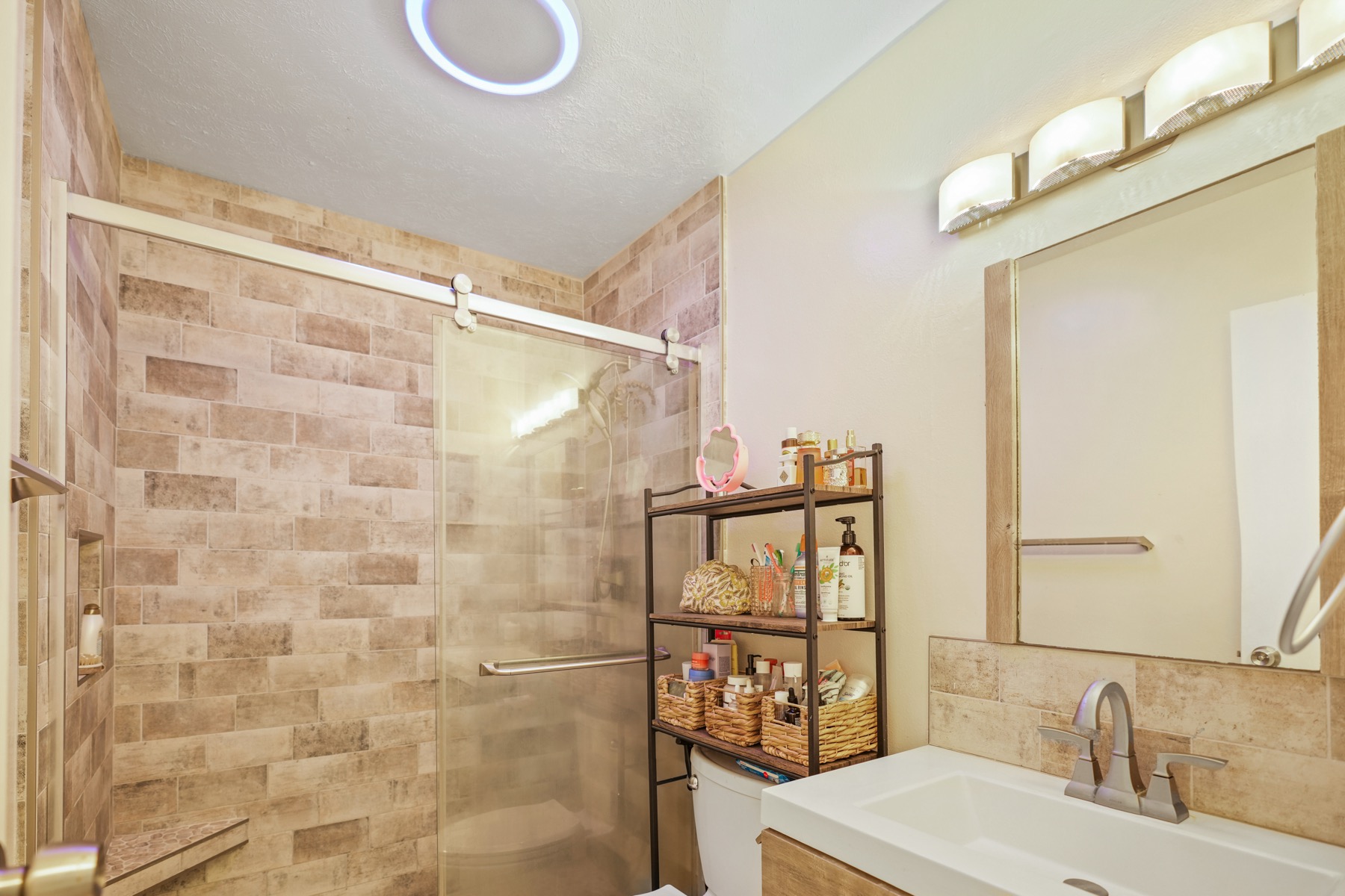 4461 Kamoa Road, Unit F21 Kapaa, HI 96746 - Photo 10 of 20 a bathroom with a sink and a mirror