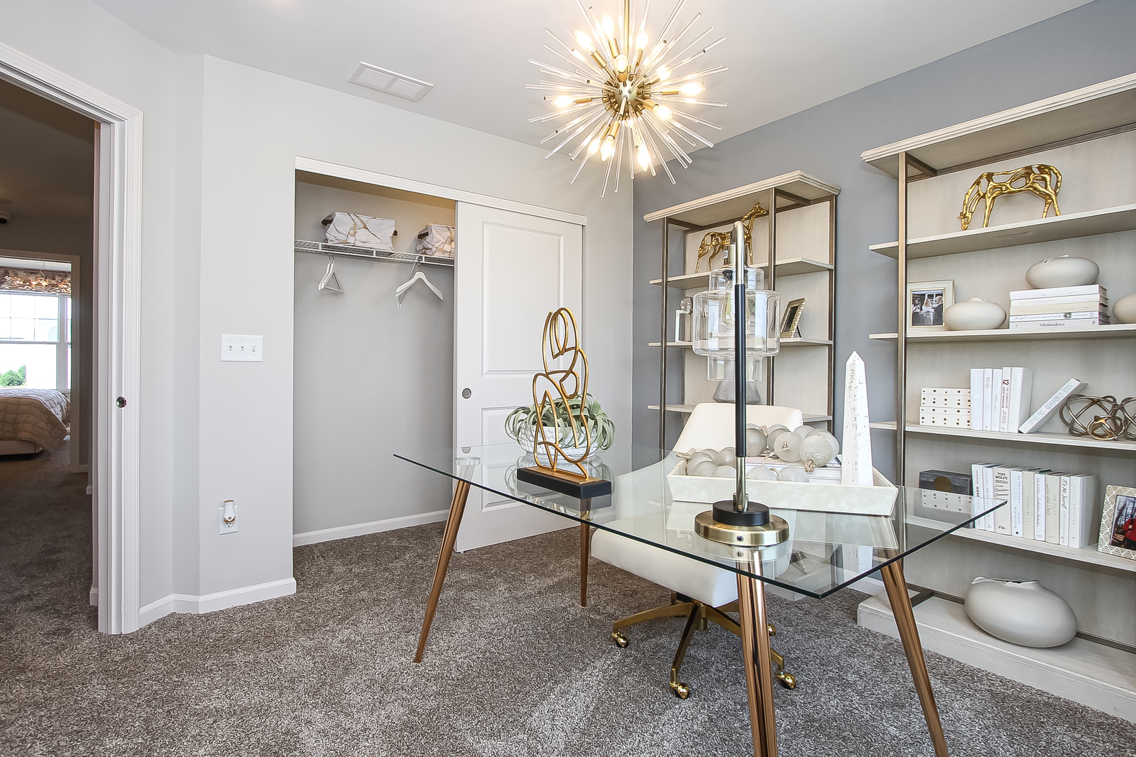 324 Kingsport Drive South Elgin, IL 60177 - Photo 22 of 25 a living room with furniture and a bookshelf