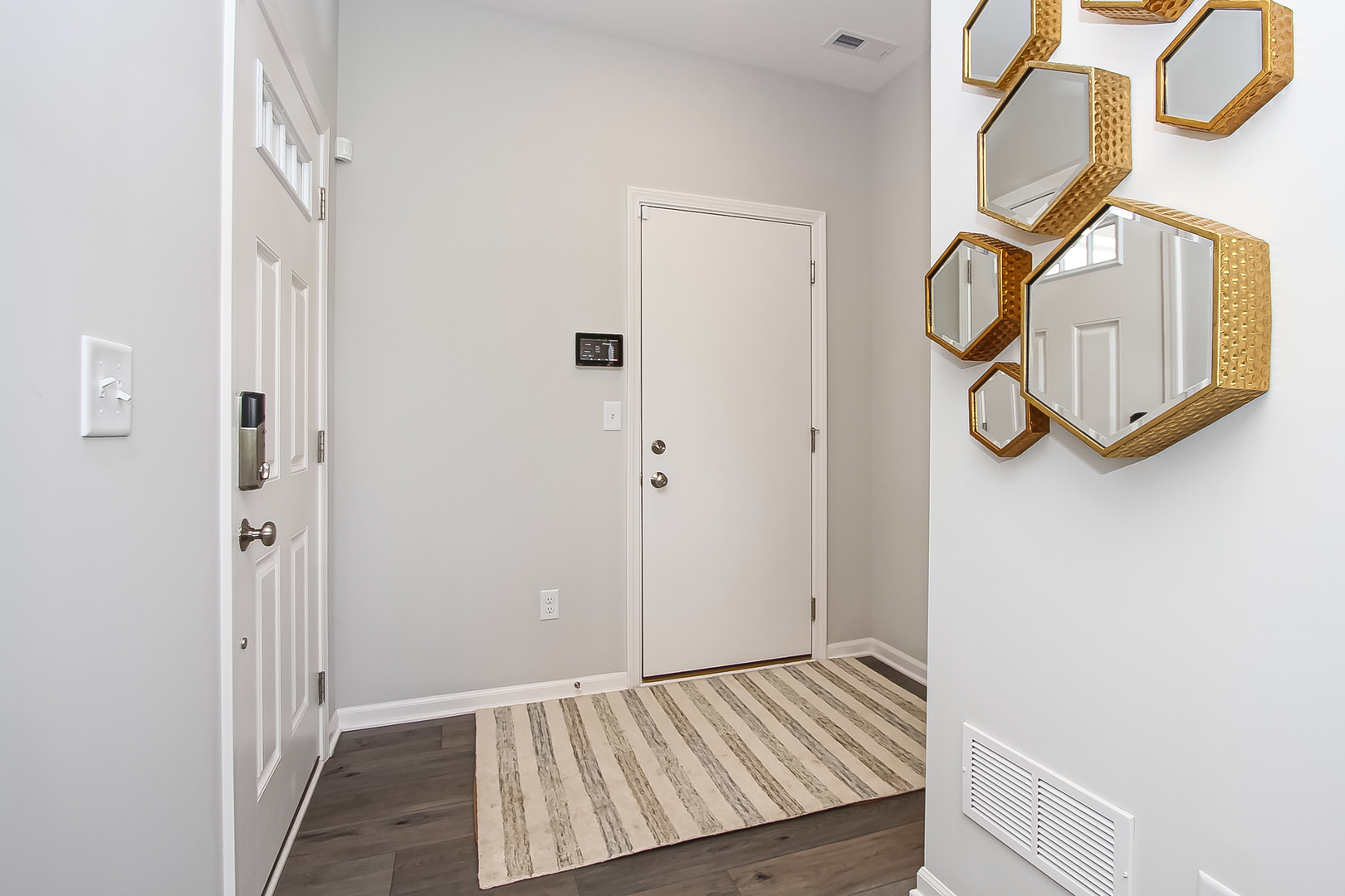 324 Kingsport Drive South Elgin, IL 60177 - Photo 23 of 25 a view of a livingroom with wooden floor and door