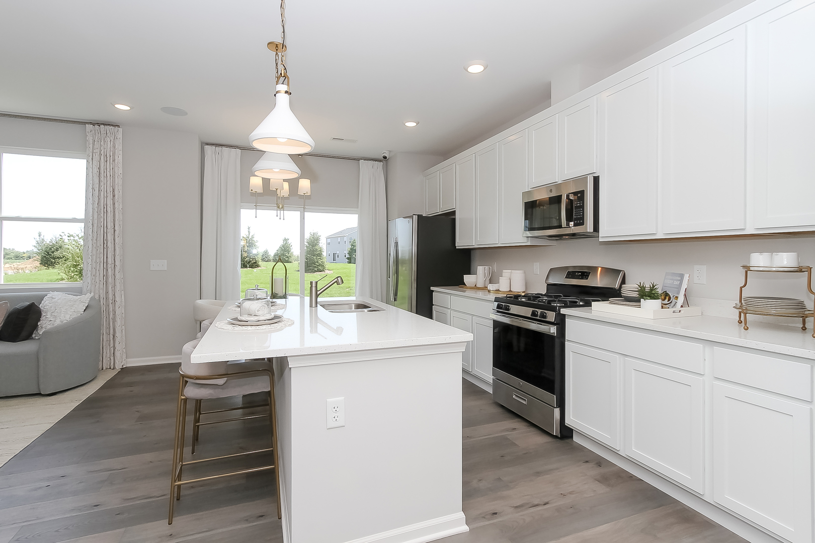 324 Kingsport Drive South Elgin, IL 60177 - Photo 7 of 25 a kitchen with a stove a sink and a refrigerator