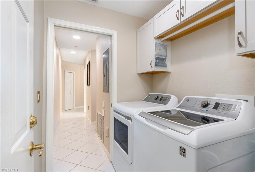 4680 Hawks Nest Way, Unit D103 Naples, FL 34114 - Photo 16 of 35 a utility room with dryer and washer