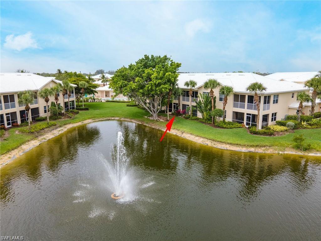 4680 Hawks Nest Way, Unit D103 Naples, FL 34114 - Photo 18 of 35 a view of building with river in front of it