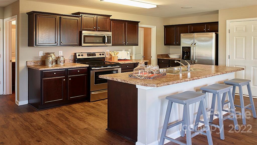 304 Gaines Road Clover, SC 29710 - Photo 12 of 48 a kitchen with a sink stove top oven and microwave