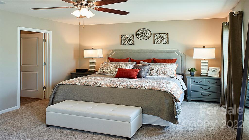 304 Gaines Road Clover, SC 29710 - Photo 20 of 48 a bedroom with a bed and a chandelier